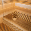 LumenStone Auro 3 indoor sauna with wood paneling and glass door