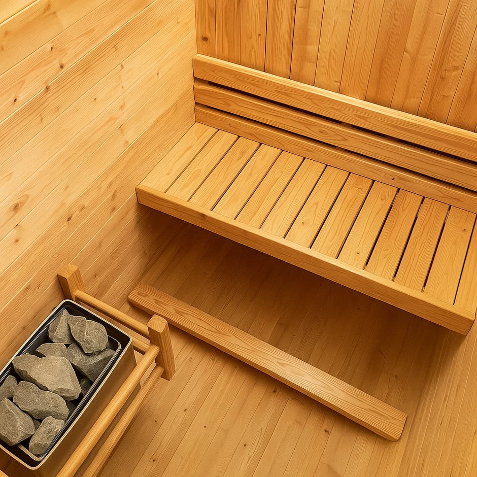 AuroraTherm cedar indoor sauna with wooden benches and glass door.