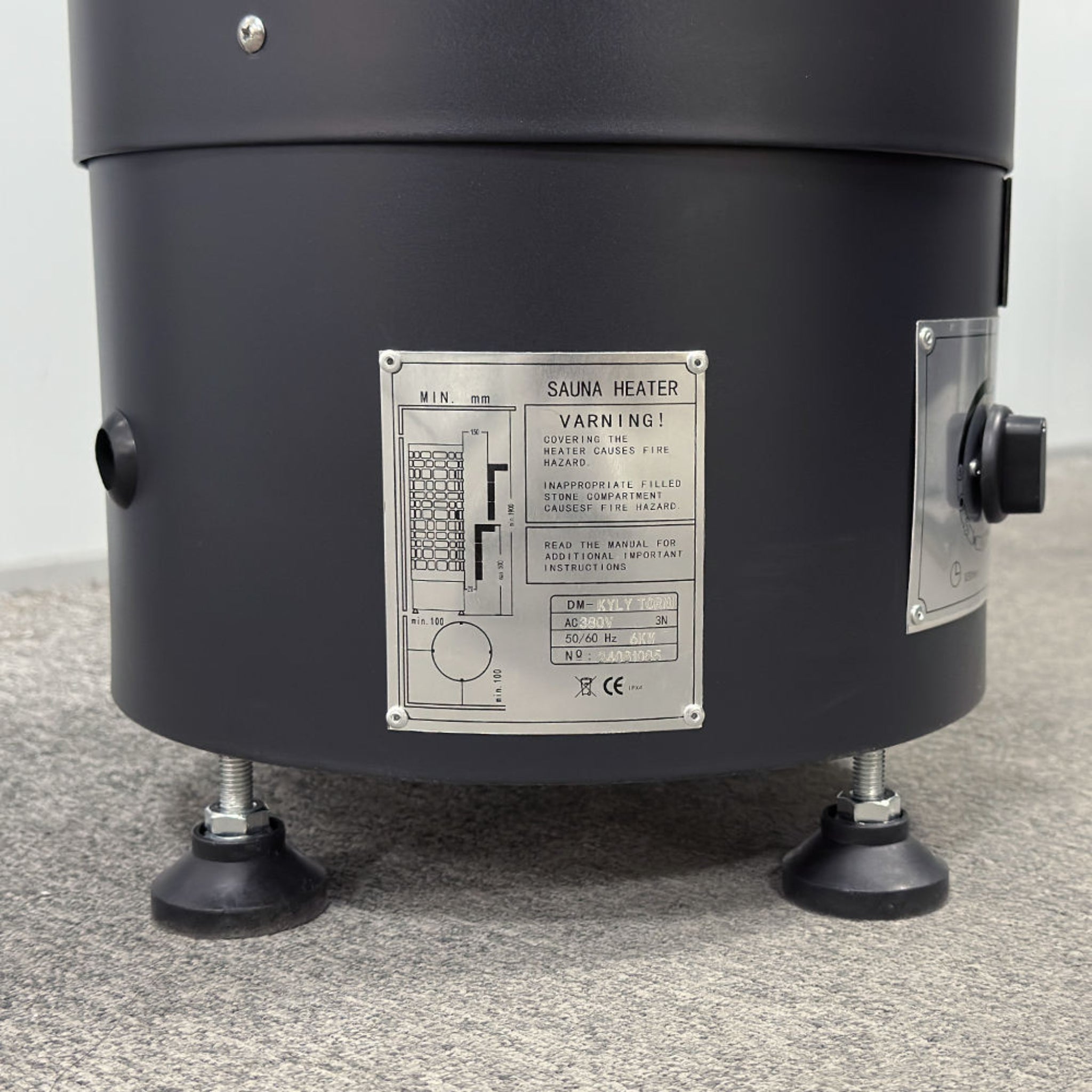 Thermexa ProGuard sauna heater with stainless steel exterior and control panel.