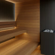 Vantaa Eclipse Luxe indoor sauna with dark wood exterior and glass door.