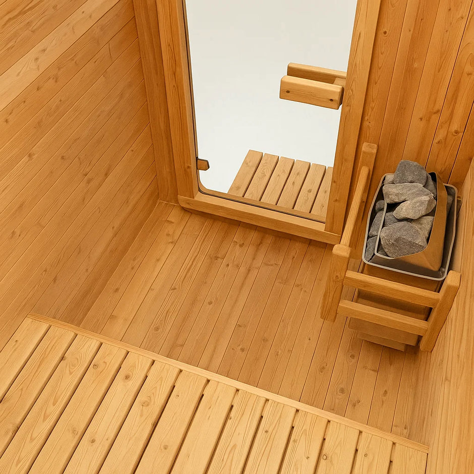 AuroraTherm cedar indoor sauna with wooden benches and glass door.